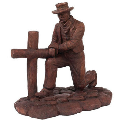Kneeling Cowboy at Cross Statue